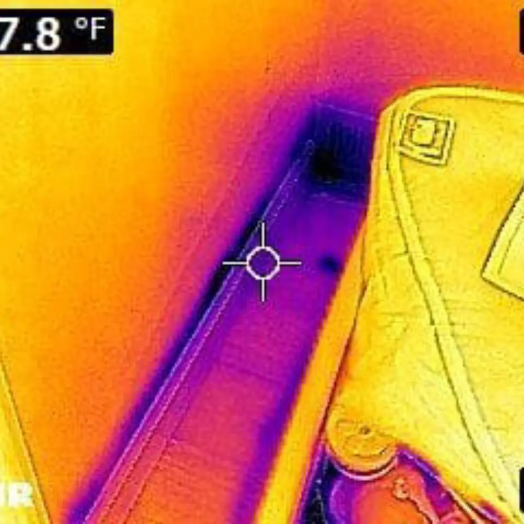 Thermal image showing potential leak detection in a residential setting, highlighting temperature variations and moisture indicators related to environmental safety assessments.