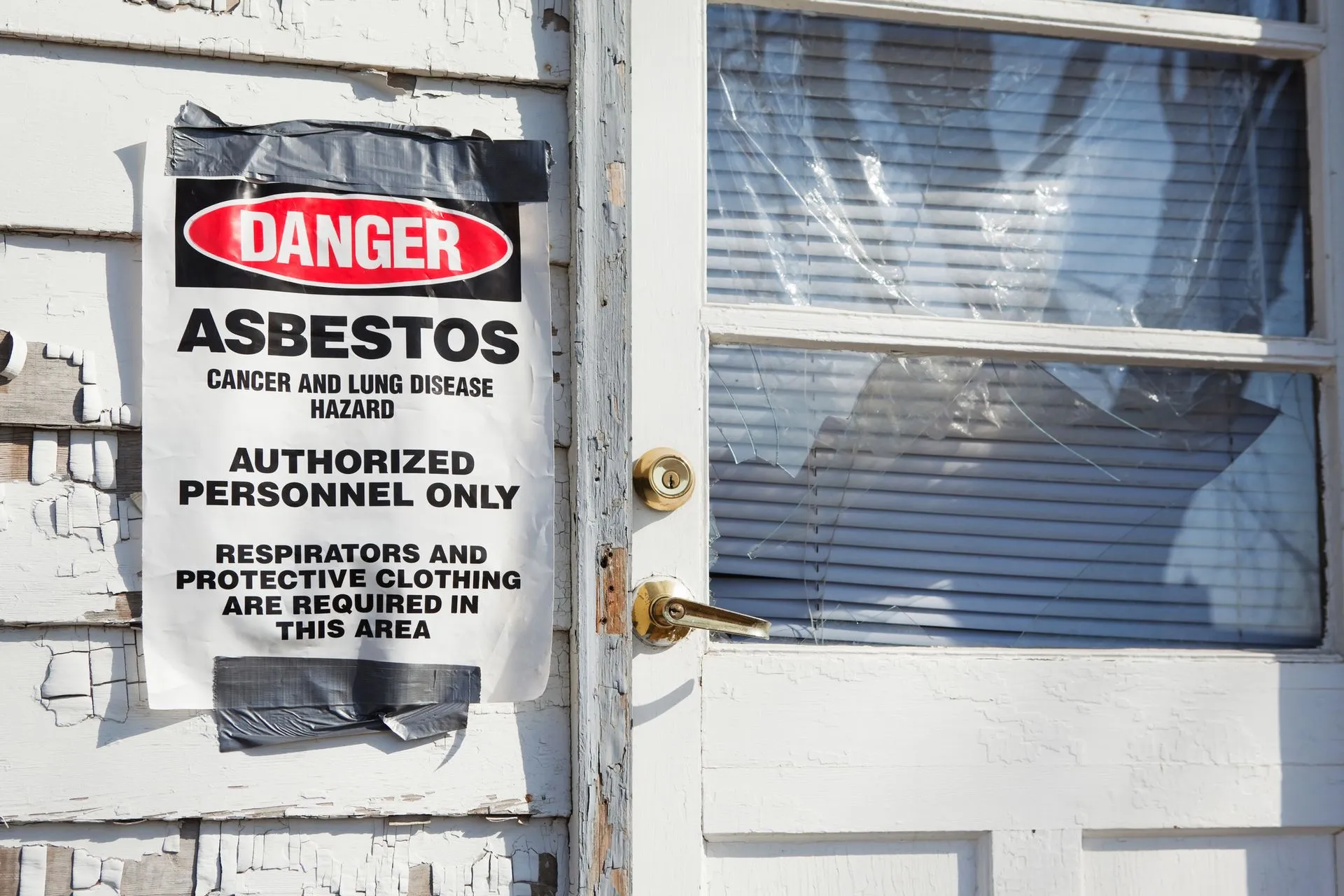 Home condemned due to asbestos-containing hazards.