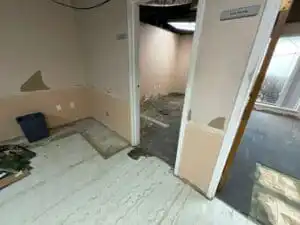 Image showing some of the flooring pulled up during a mold remediation.